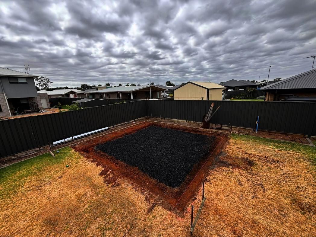 A Fence and a Pile of Dirt in the Middle of It — Spencer's Landscape Construction & Concreting Pty Ltd in Orange, NSW
