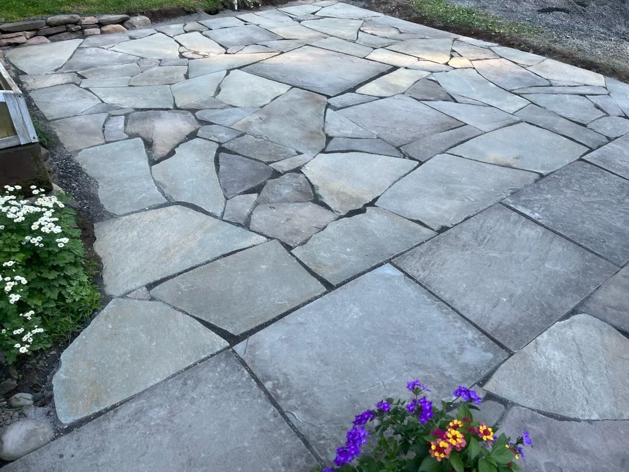 Gray granite tile wall with light-colored grout lines.