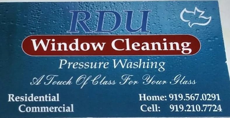 RDU Window Cleaning sign with blue background, red banner, and phone numbers for residential and commercial services
