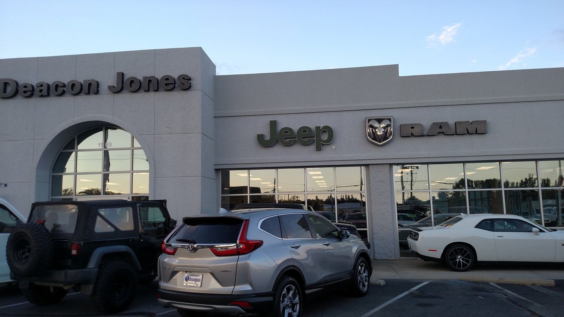 Deacon Jones Jeep and Ram dealership exterior with parked vehicles in front