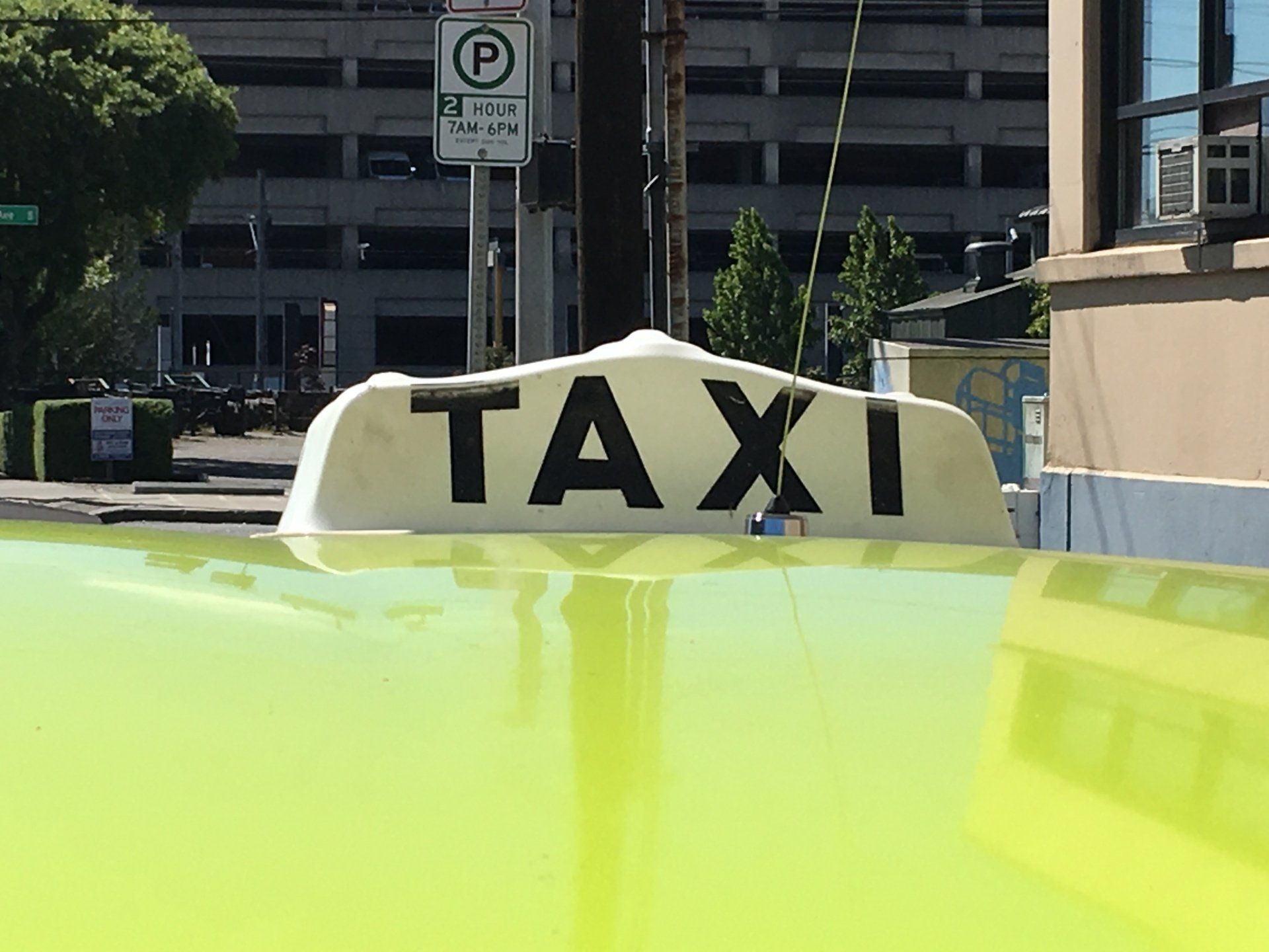 Yellow Taxi On A City Street With A Passenger — Seattle, WA — Farwest Taxi Yellow Taxi On A City Street With A Passenger — Seattle, WA — Farwest Taxi
