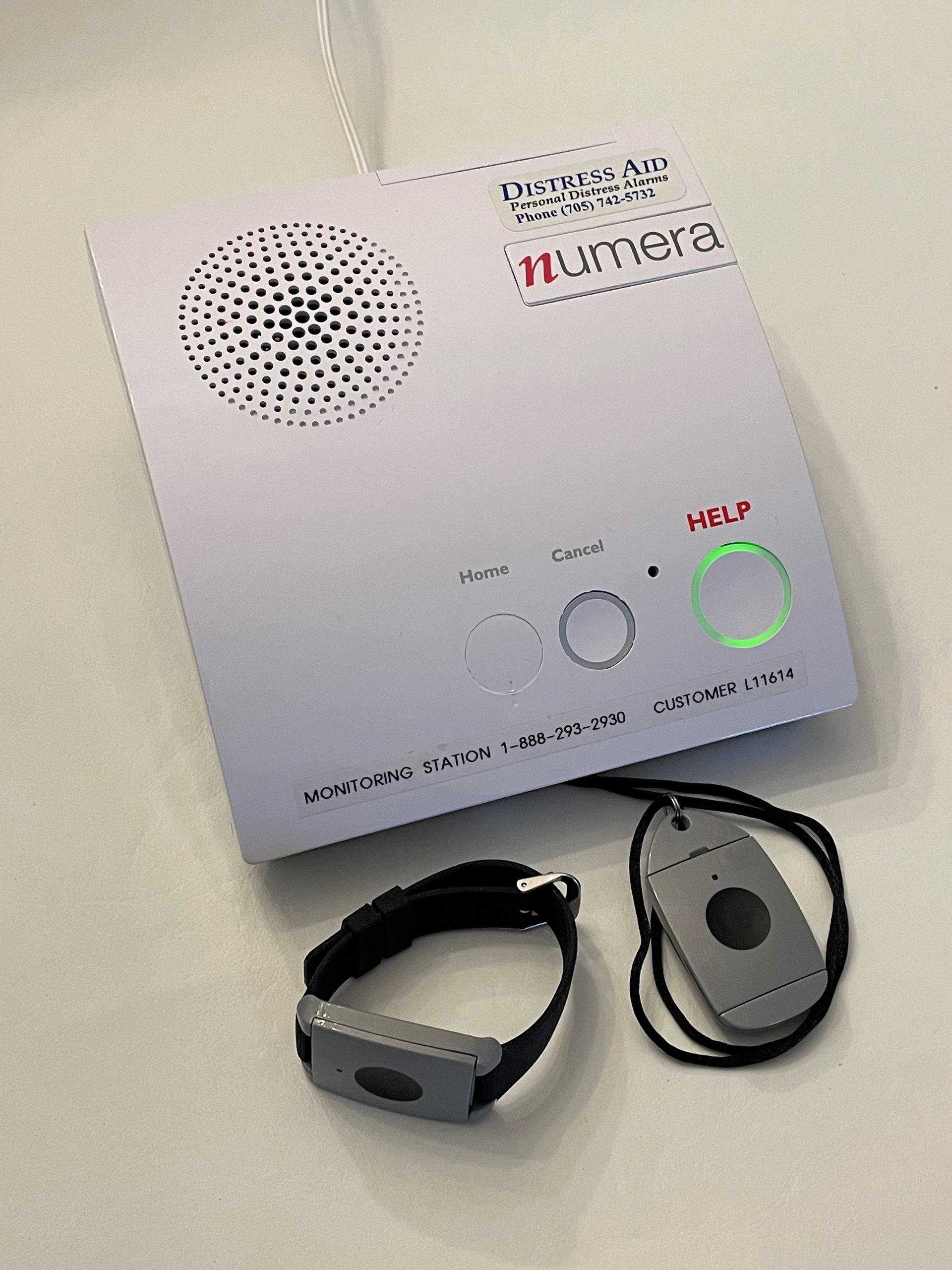 A remote control with a bracelet attached to it