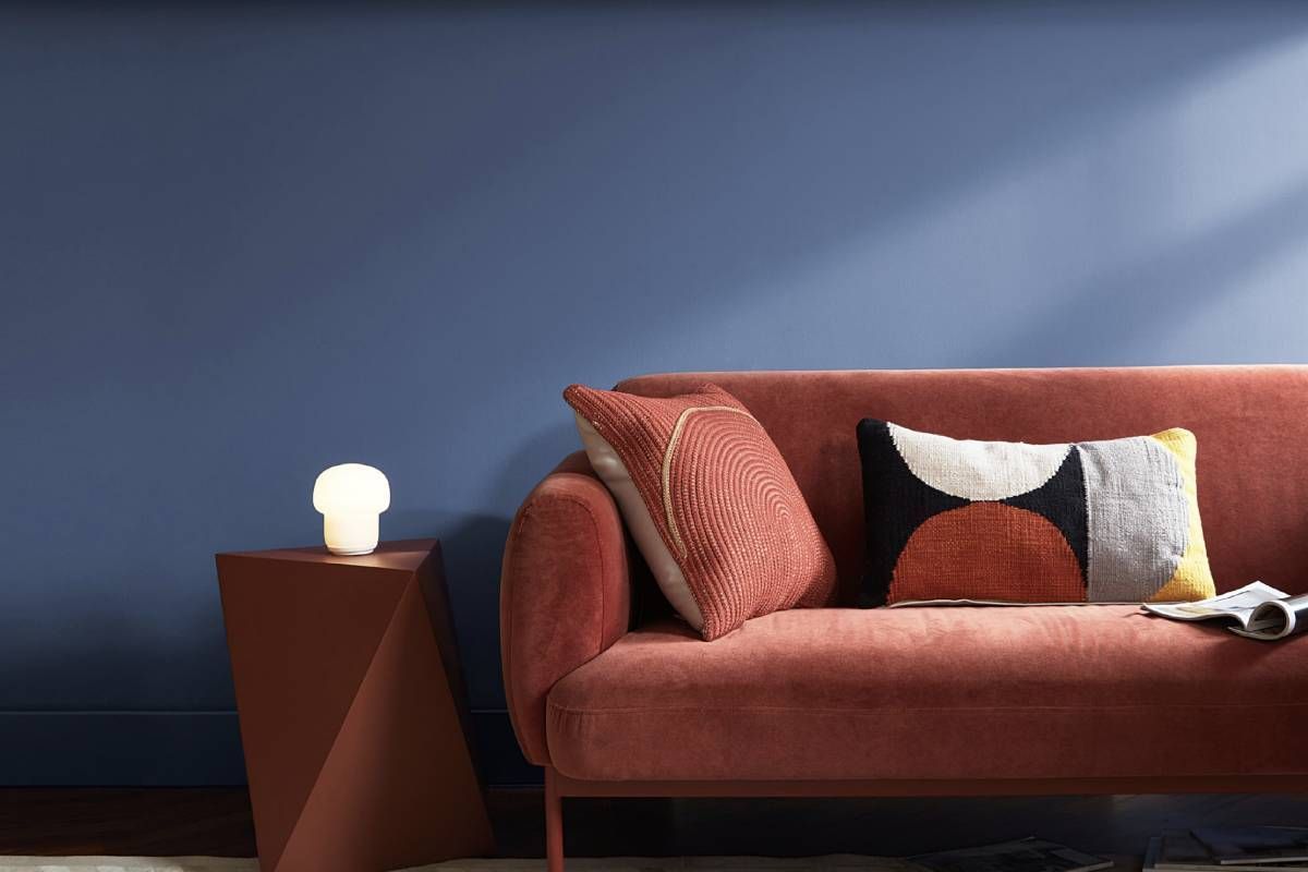 Couch with back wall painted in exciting Blue Nova