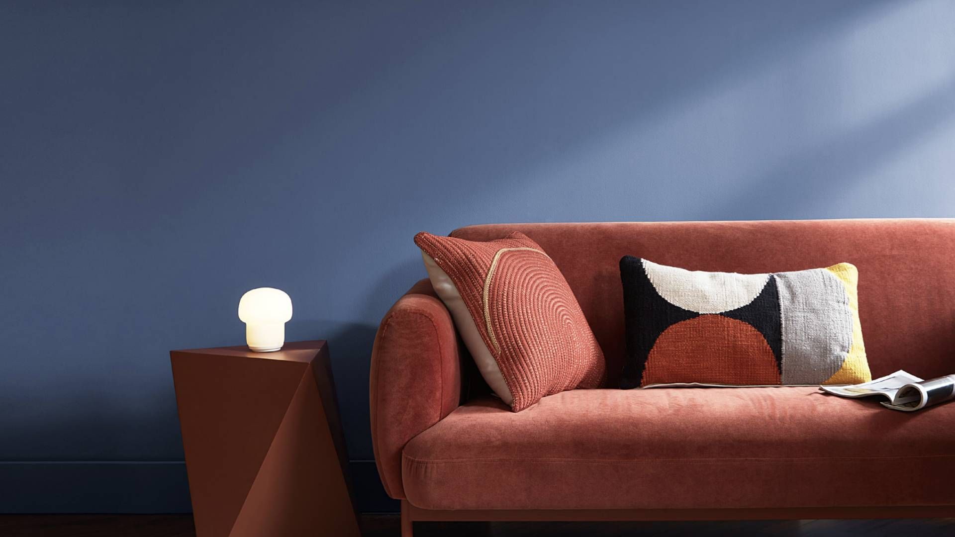 Couch with back wall painted in exciting Blue Nova