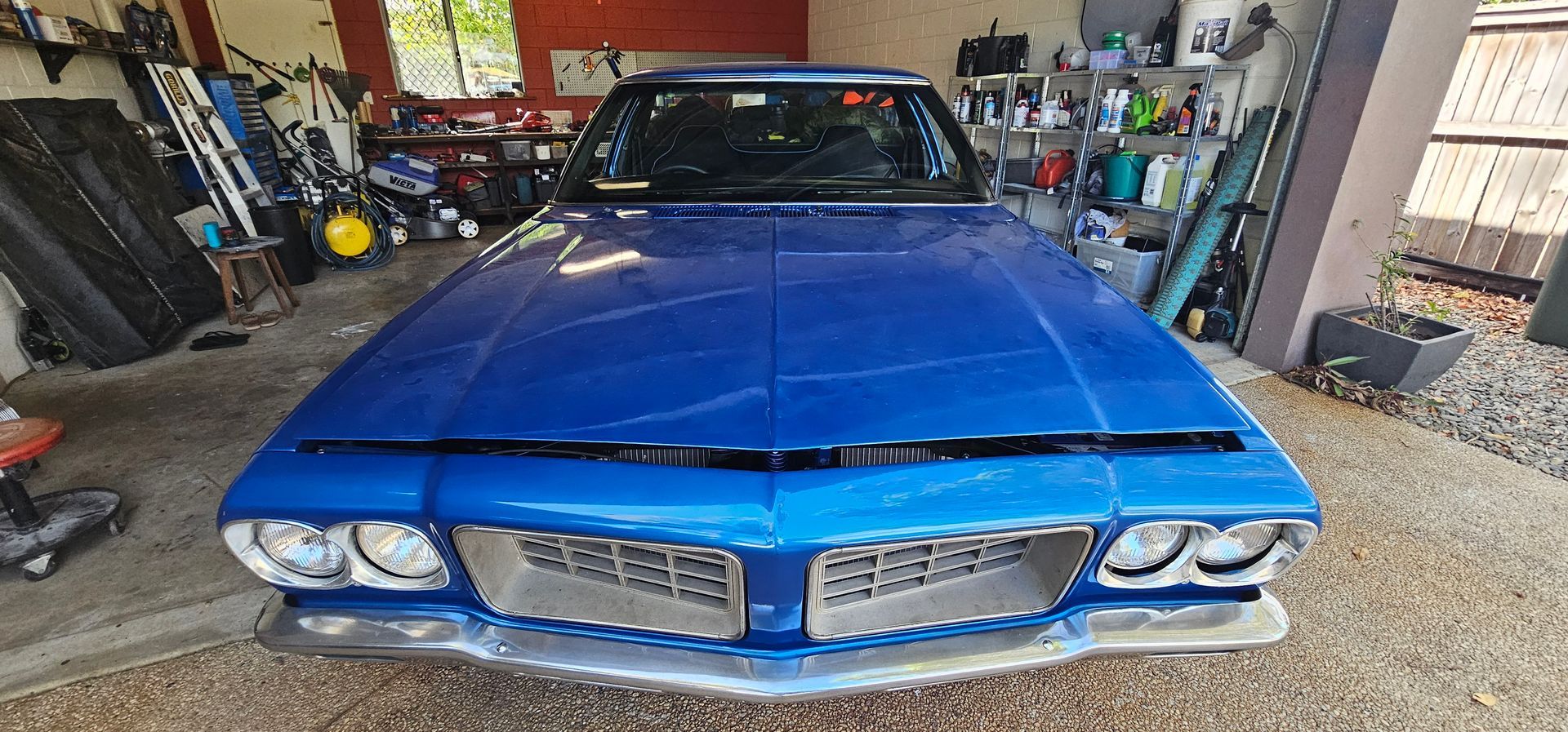 A Close up Of a Car Windshield Being Replaced in A Garage — FNQ Windscreens in Bungalow, QLD