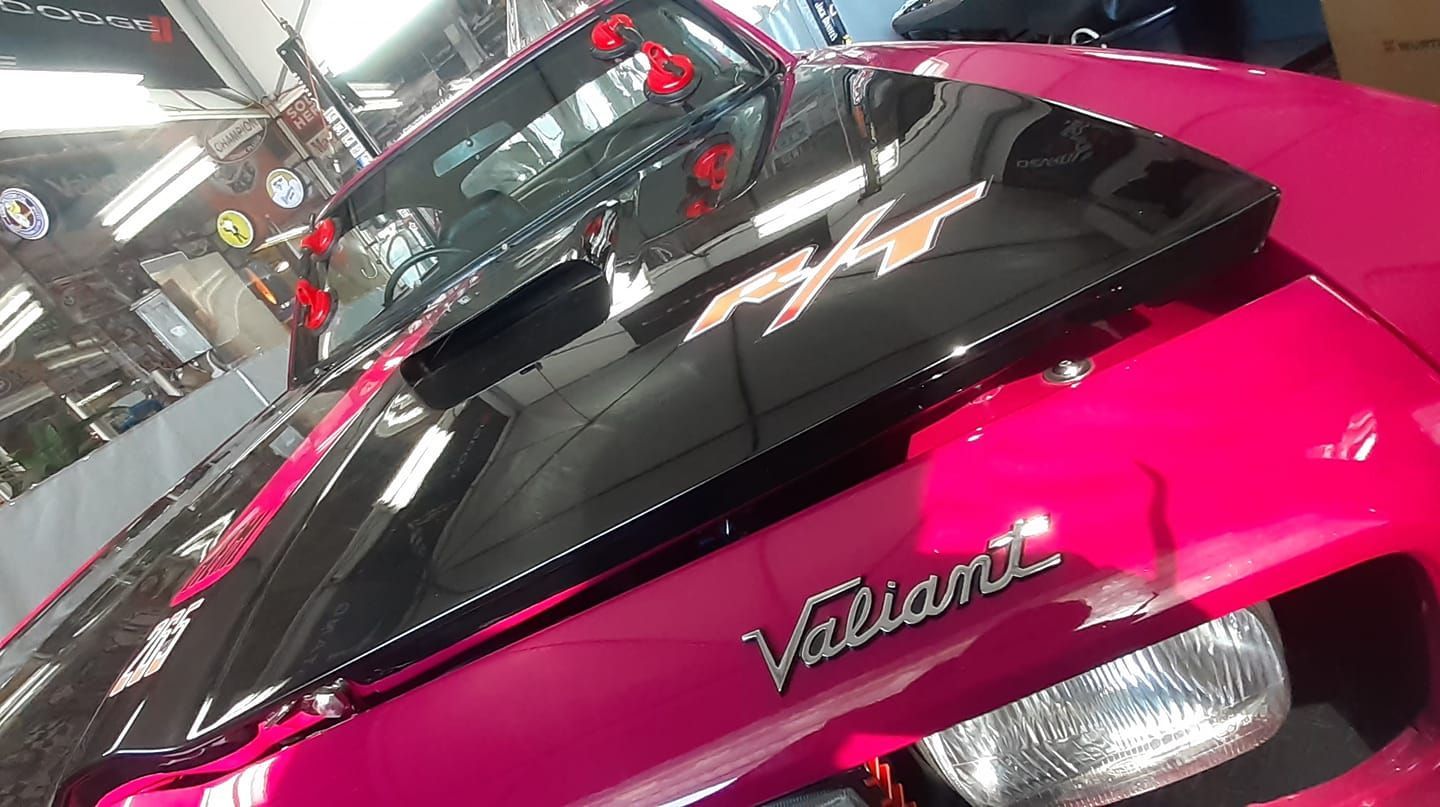 A pink and black car getting it's windscreen replaced — FNQ Windscreens in Bungalow, QLD