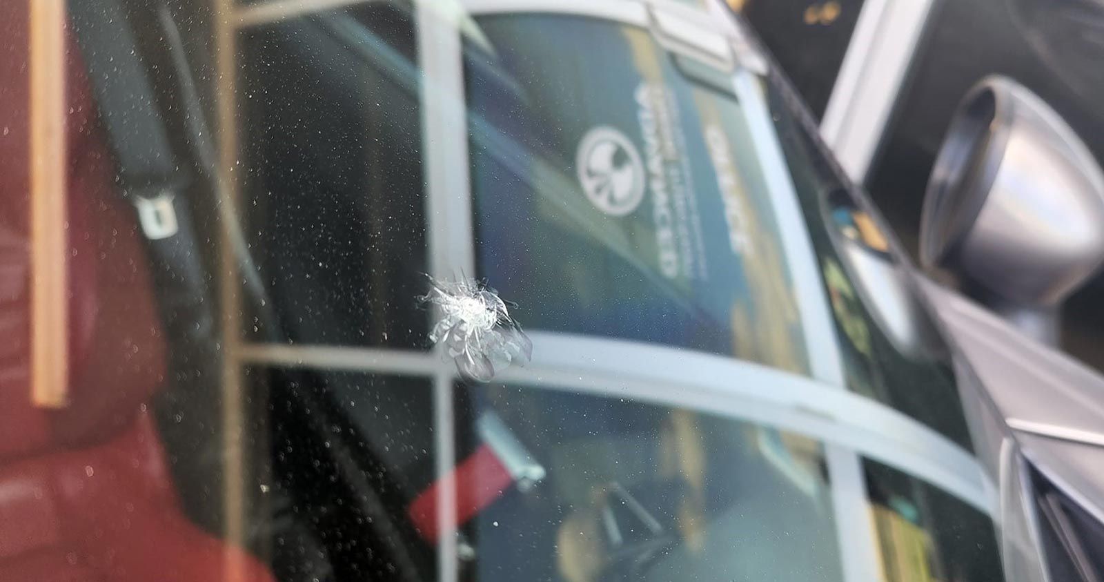 A Close up Of a Car Windshield with A Hole in It — FNQ Windscreens in Bungalow, QLD