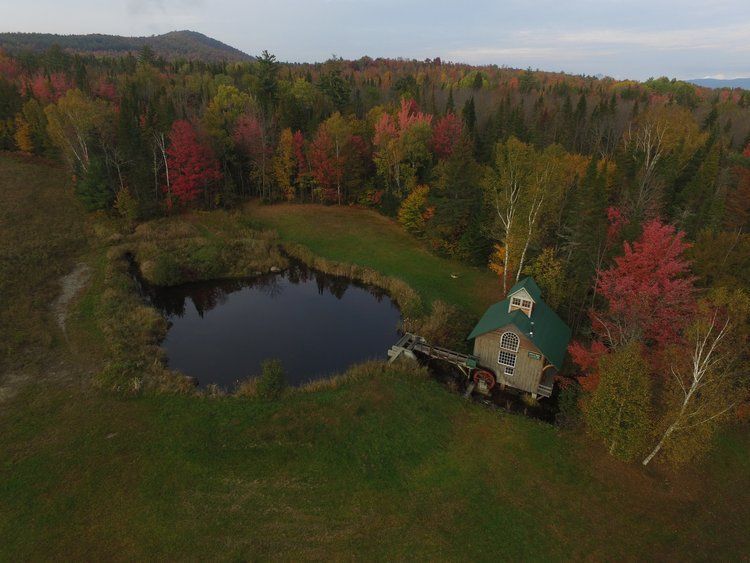 House with a pond in autumn