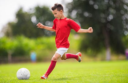 A Kid Playing Soccer A Kid Playing Soccer