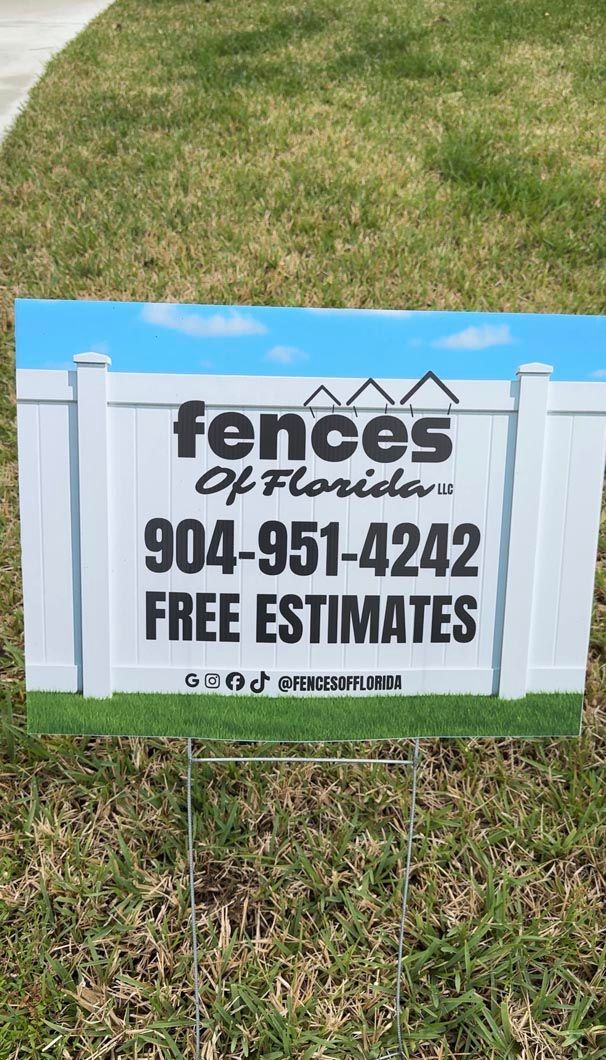 White fence repair sign on grass with blue sky background, reading “fences of florida,” phone number, and “FREE ESTIMATES”