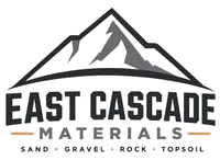 East Cascade Materials logo with mountain graphic and tagline: sand, gravel, rock, topsoil.