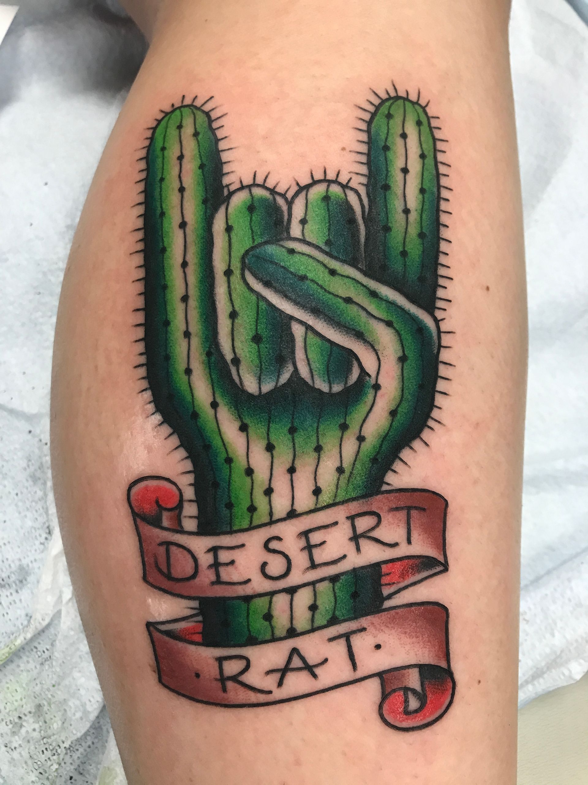 Cactus hand gesture tattoo with 