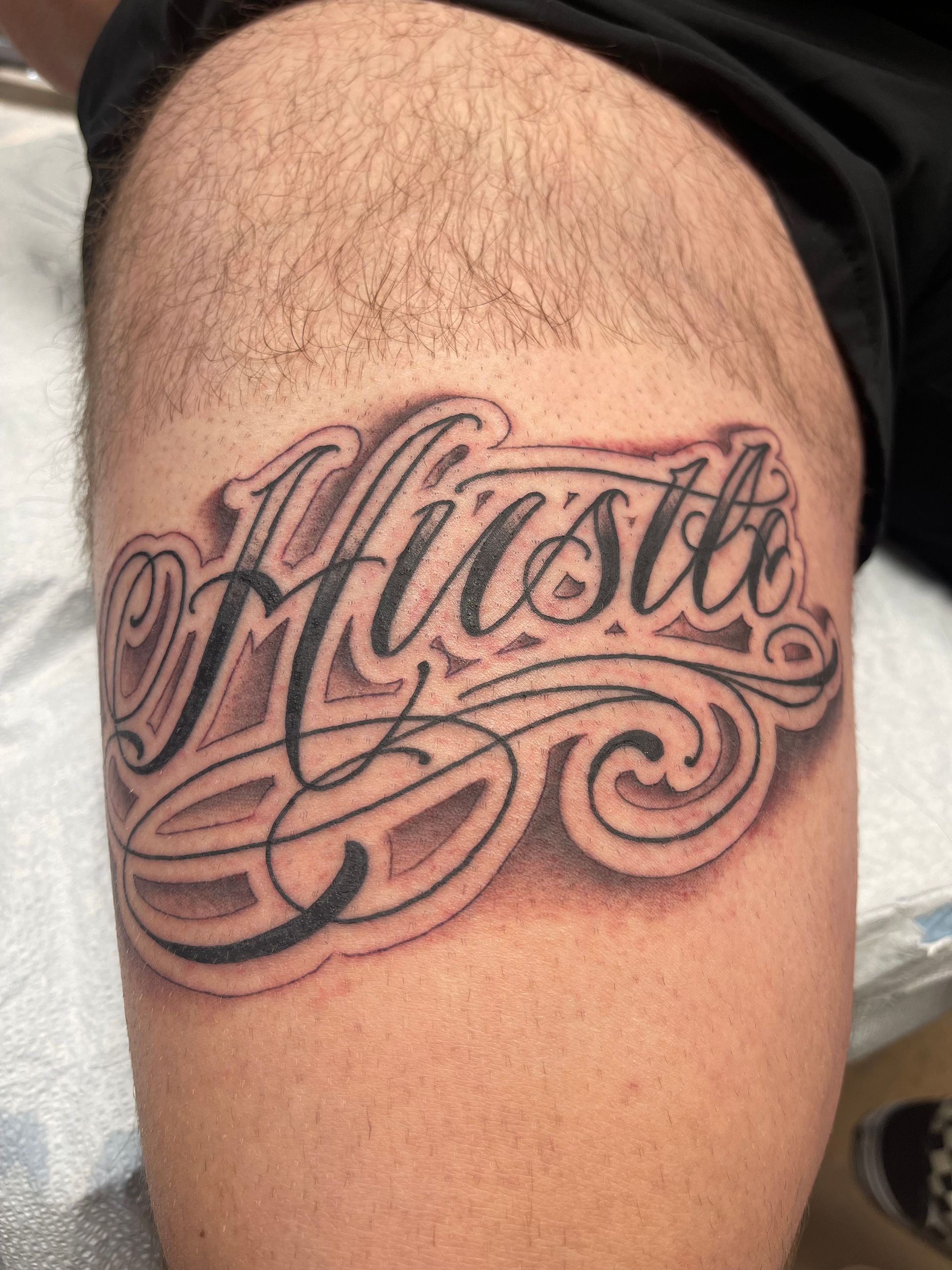 Tattoo on a leg that says 