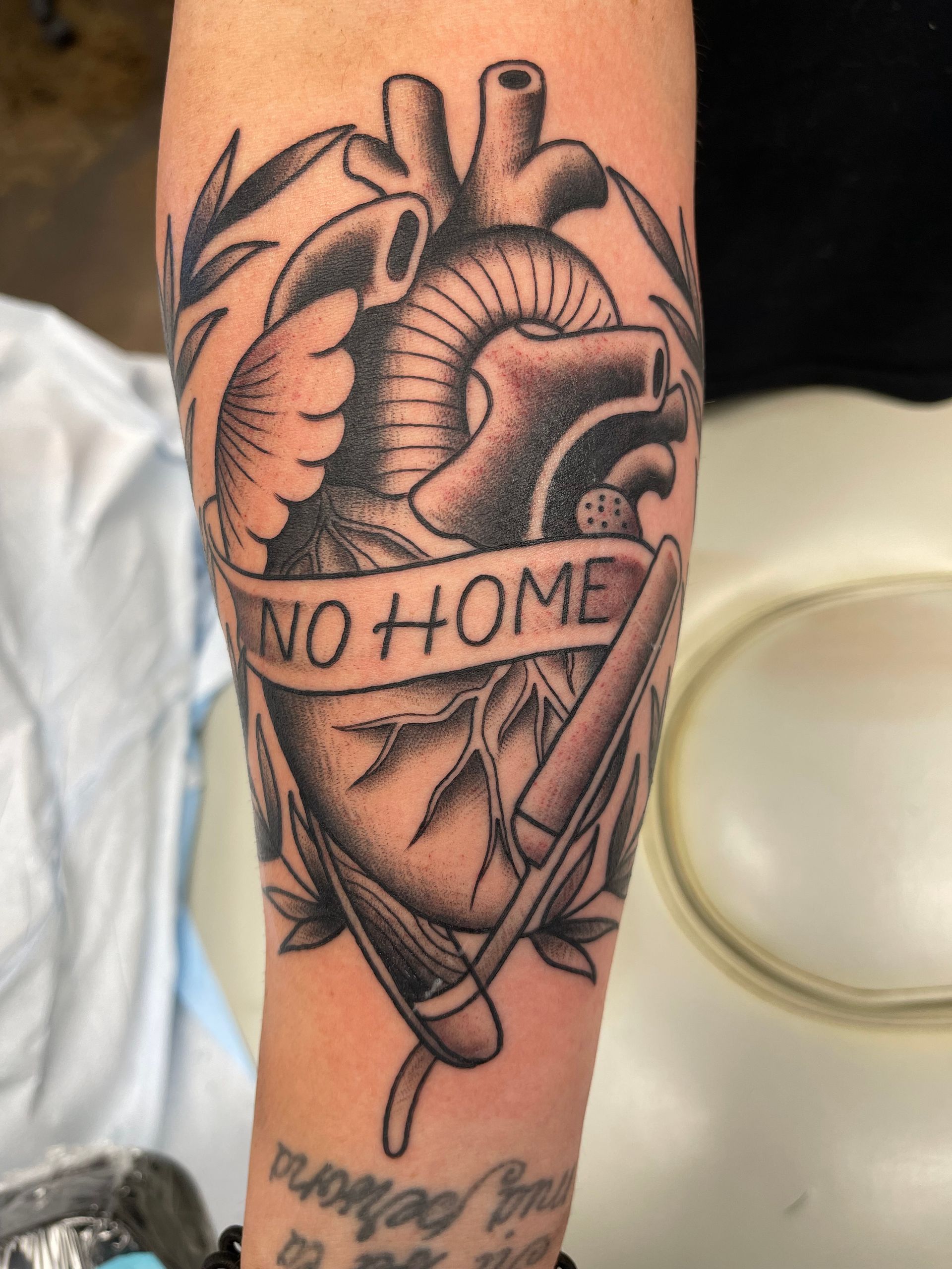 Tattoo of a human heart with 