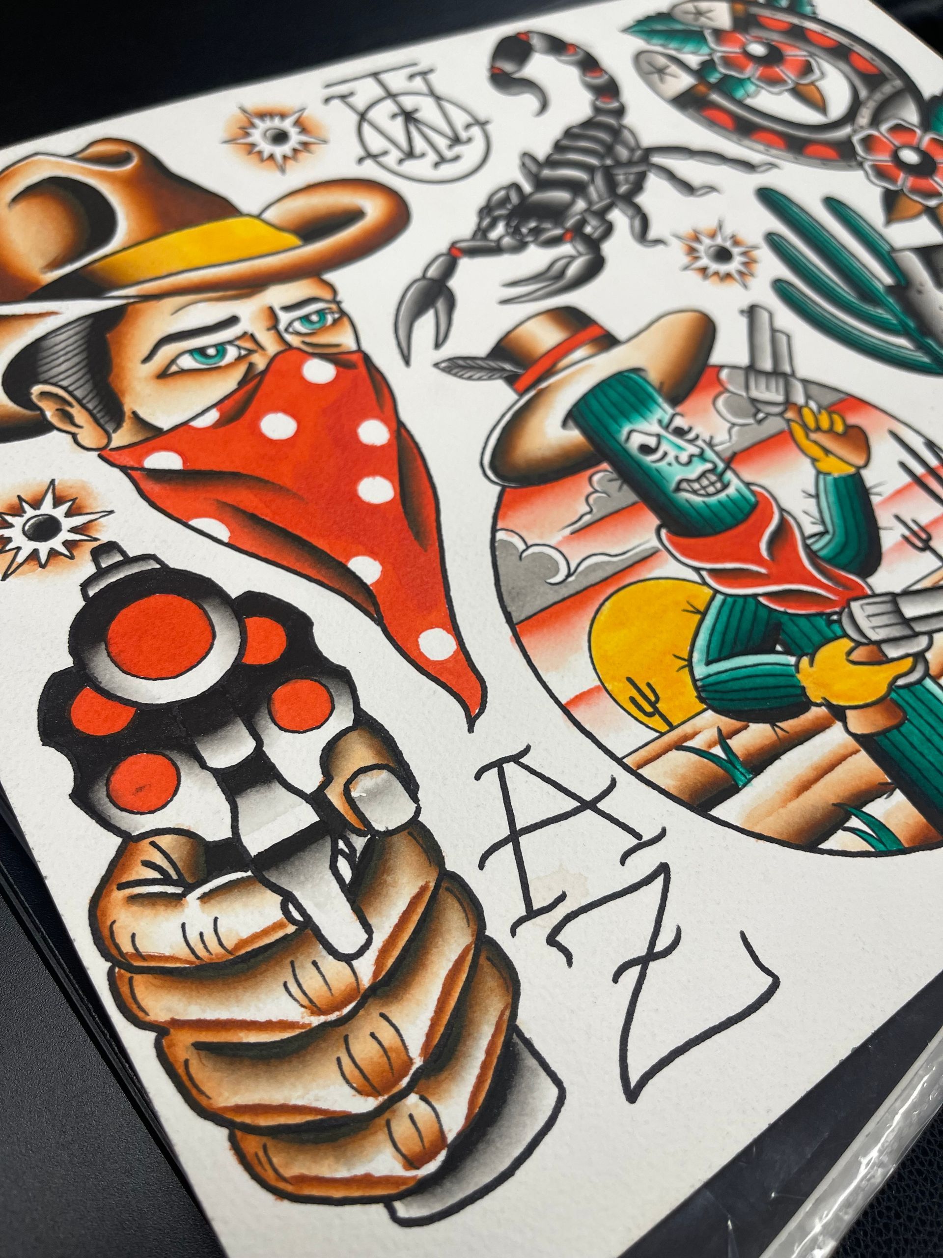 Tattoo flash sheet with cowboy, gun, scorpion, and Arizona themed designs. Bold colors, traditional style.