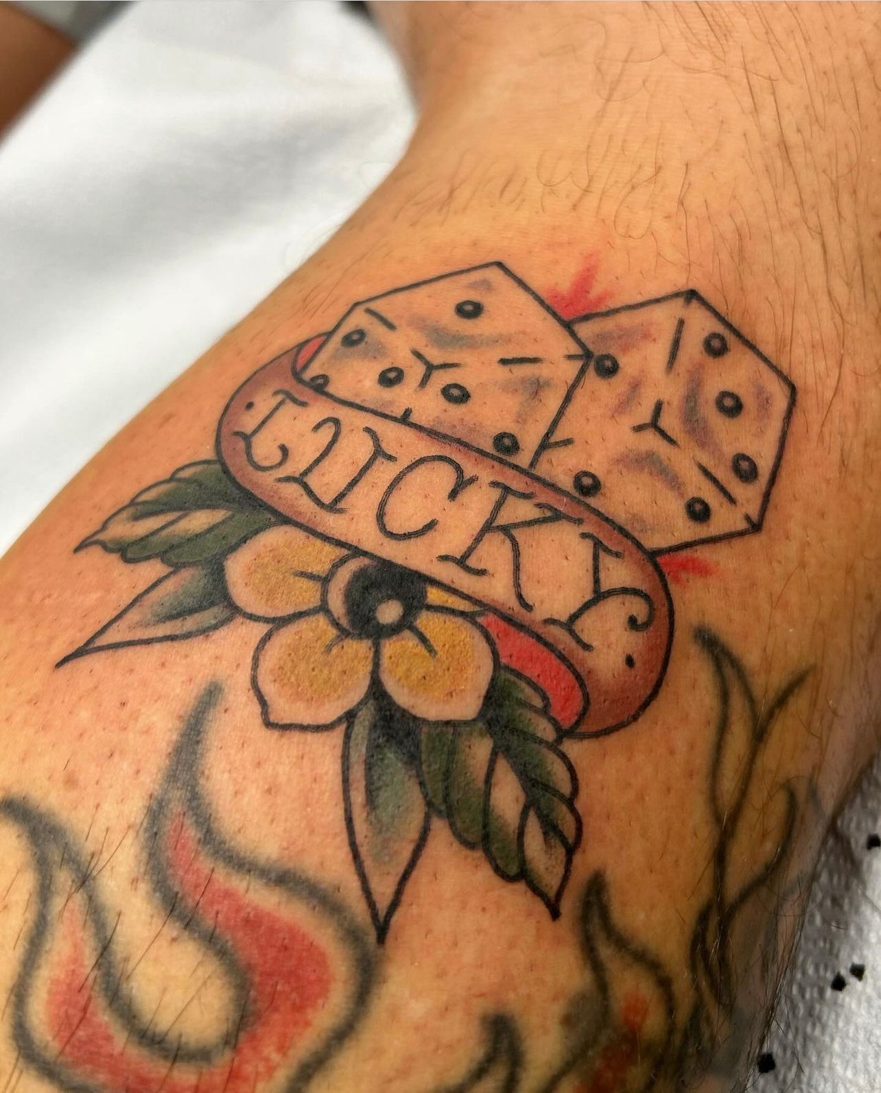 Tattoo on skin: dice with 