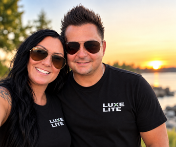 Man wearing a black t-shirt with “Luxe Lite” logo, looking at the viewer.