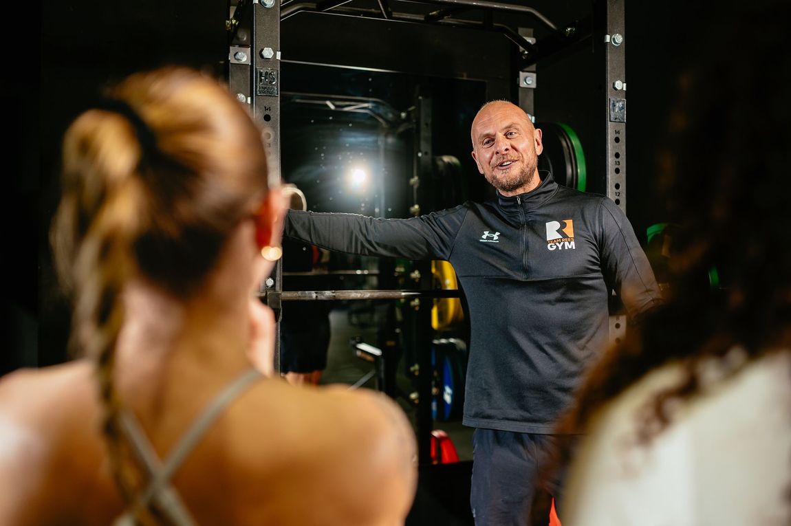 Personal trainer coaching a member at Team Rees Gym in Caerphilly during a one-to-one gym session.