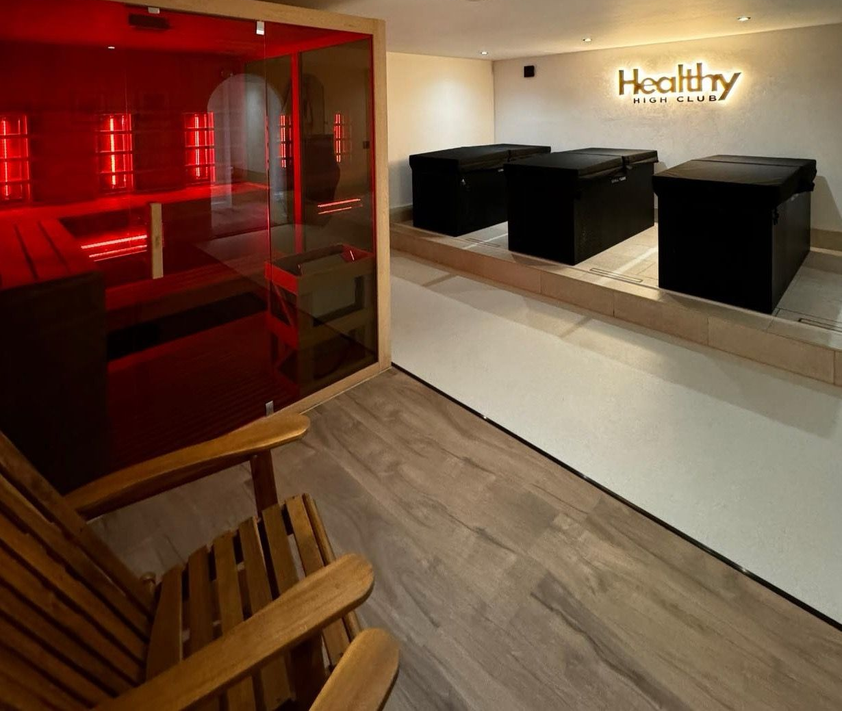 Sauna and ice bath contrast therapy at Team Rees Gym in Caerphilly, featuring a traditional stove sauna, red-light sauna and cold-water ice baths.