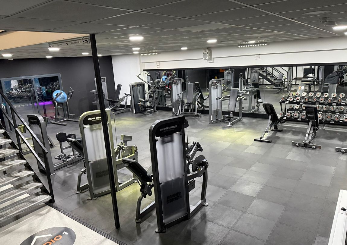 Beginner-friendly selectorised weight-training zone at Team Rees Gym in Caerphilly, featuring easy-to-use resistance machines and lighter dumbbells.
