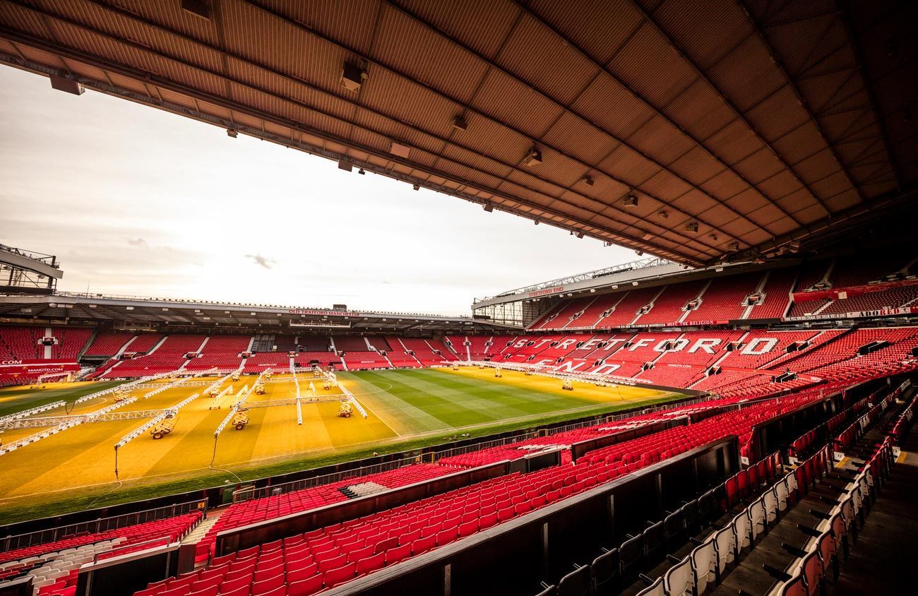 Empty red stadium seats, view of the field.