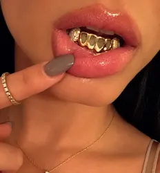 Girl with gold custom grill 