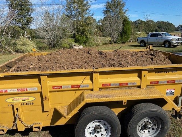 Yellow Trailer Filled With Brown Soil
