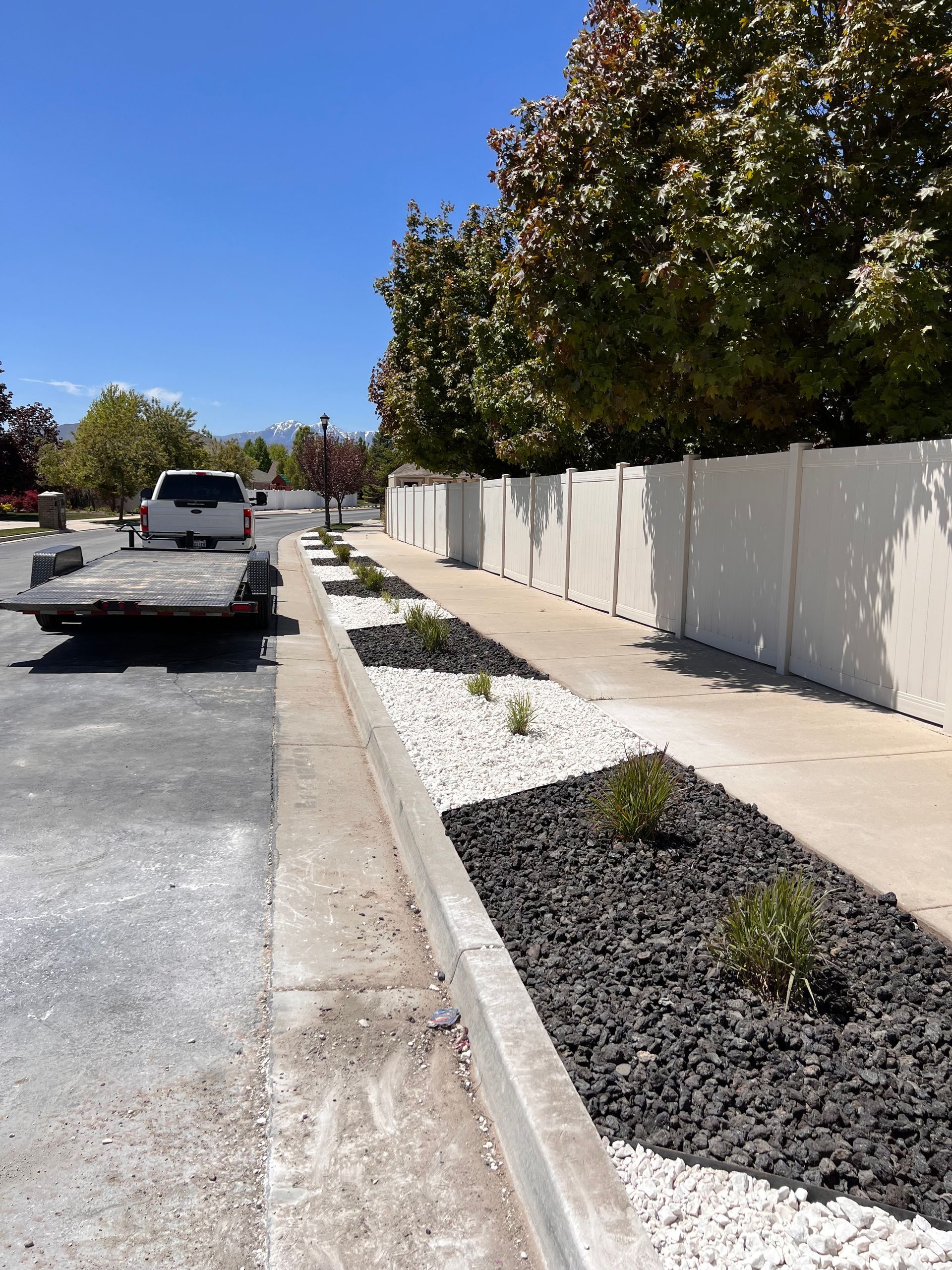 White Truck is parked on the side of the Road - South Jordan, UT – MD Property Maintenance & Landscaping