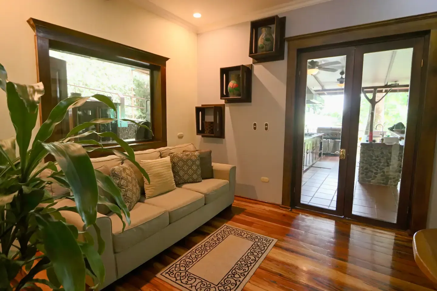 A living room with a couch and a rug