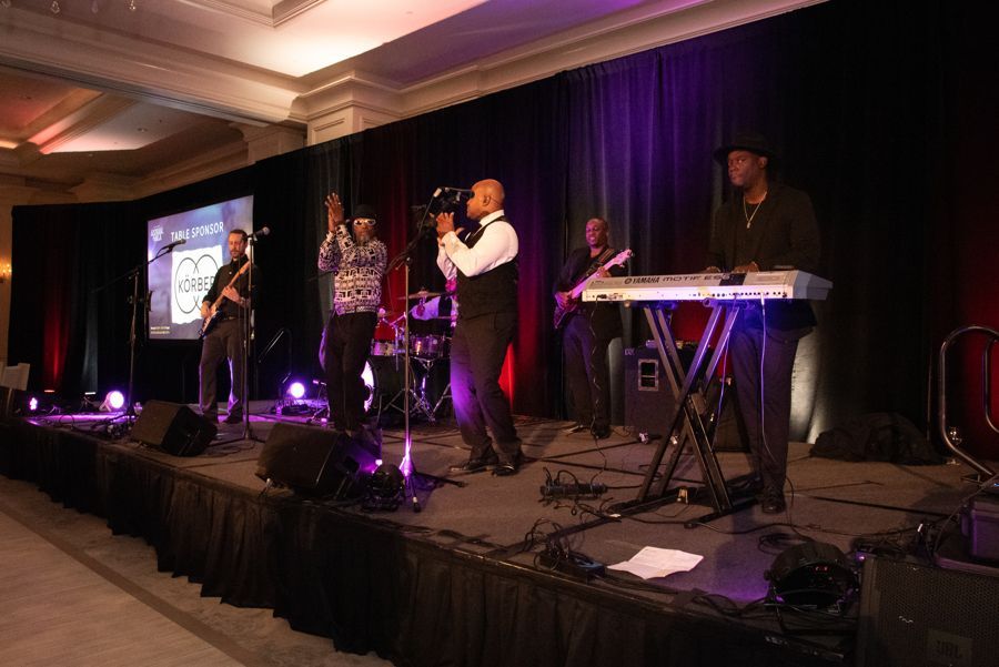 A premium event crowd enjoying a live band