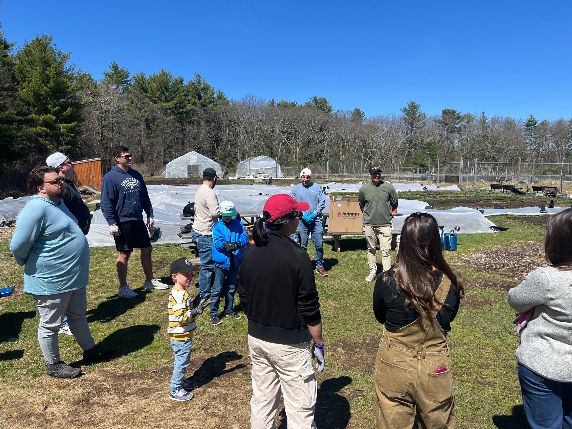 The Boston team at the Needham Community Farm working together in the community garden
