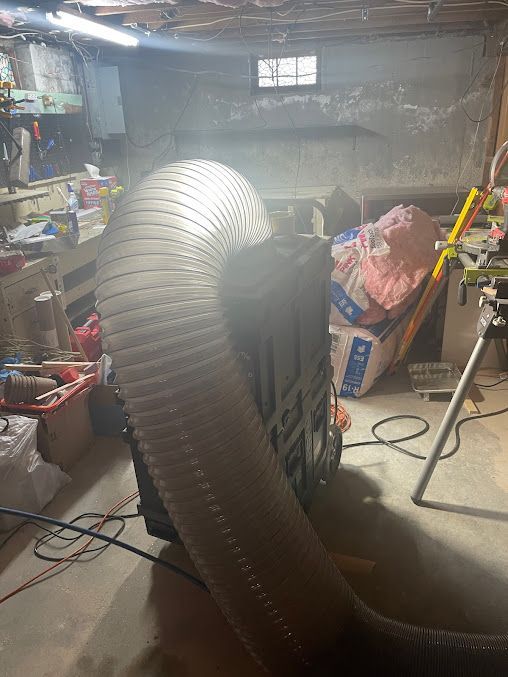 A vacuum cleaner is being used to clean a basement.