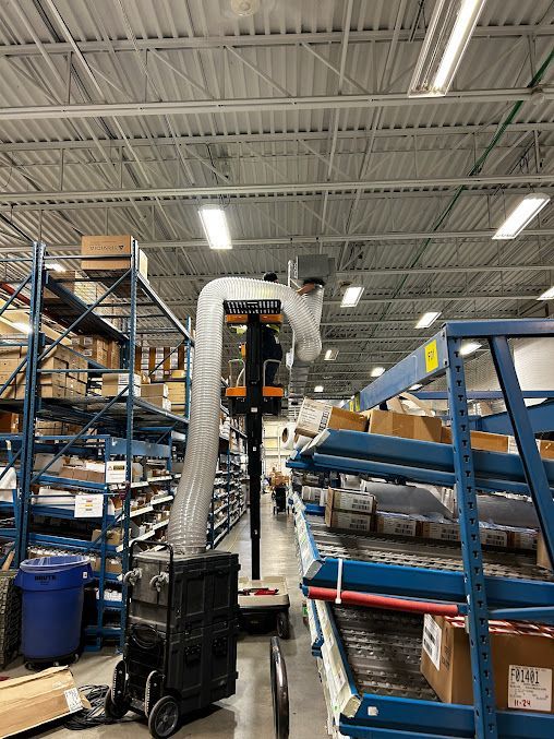 A large warehouse filled with lots of shelves and boxes.