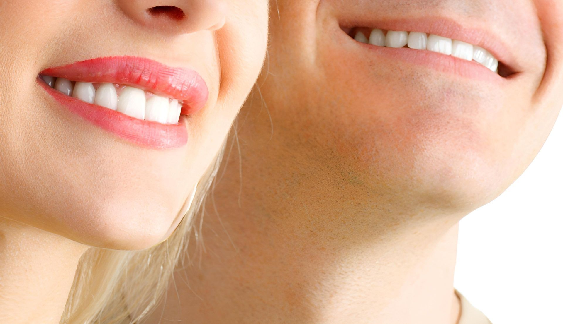 A Man and A Woman Are Smiling for The Camera — Steve King Dental Group in Edmonton, QLD