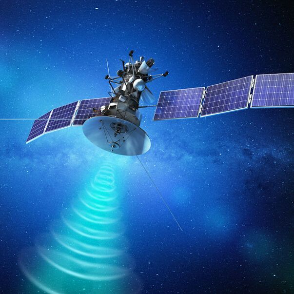Satellite in space with solar panels, sending radio waves toward Earth. 
