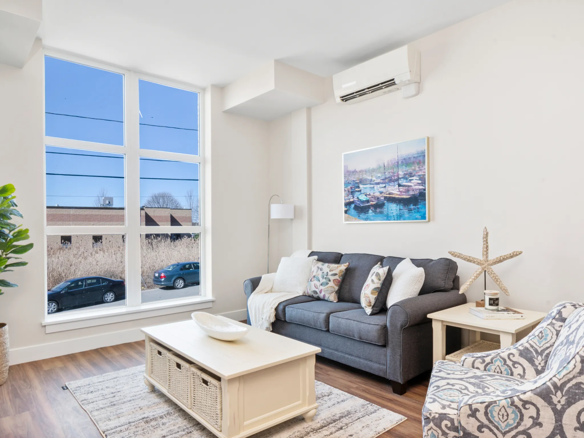 Newburyport Crossing apartment living room with oversized window.