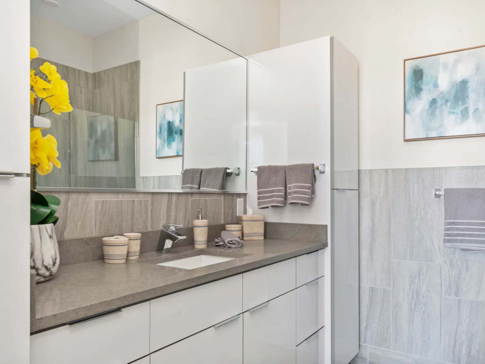 Newburyport Crossing modern bathroom with oversized mirror. 