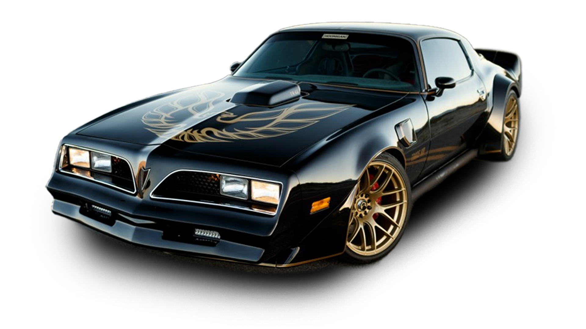 A black Pontiac Trans Am with a gold eagle hood decal and custom gold wheels, isolated on a white background.
