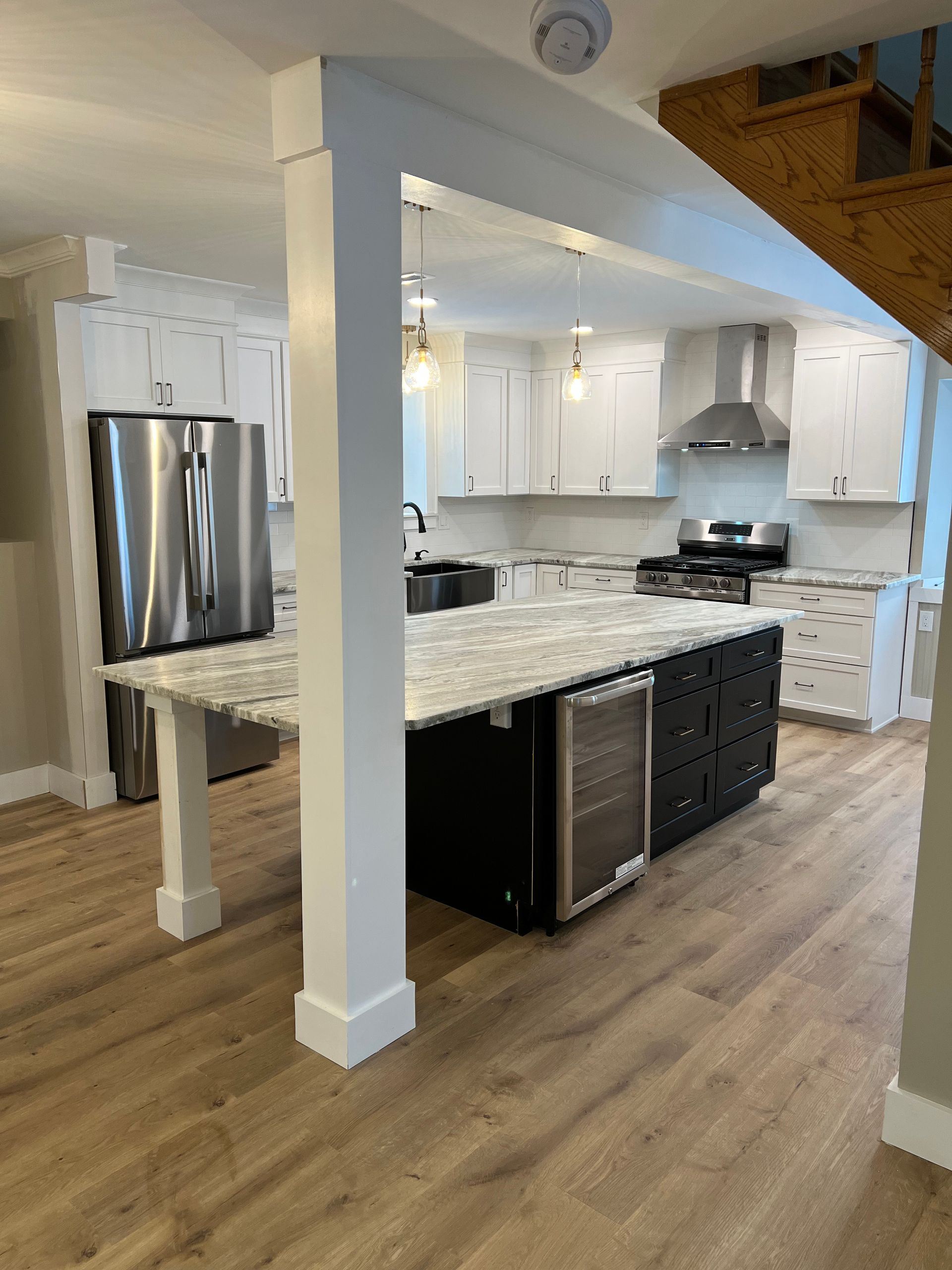 A kitchen with stainless steel appliances and granite counter tops