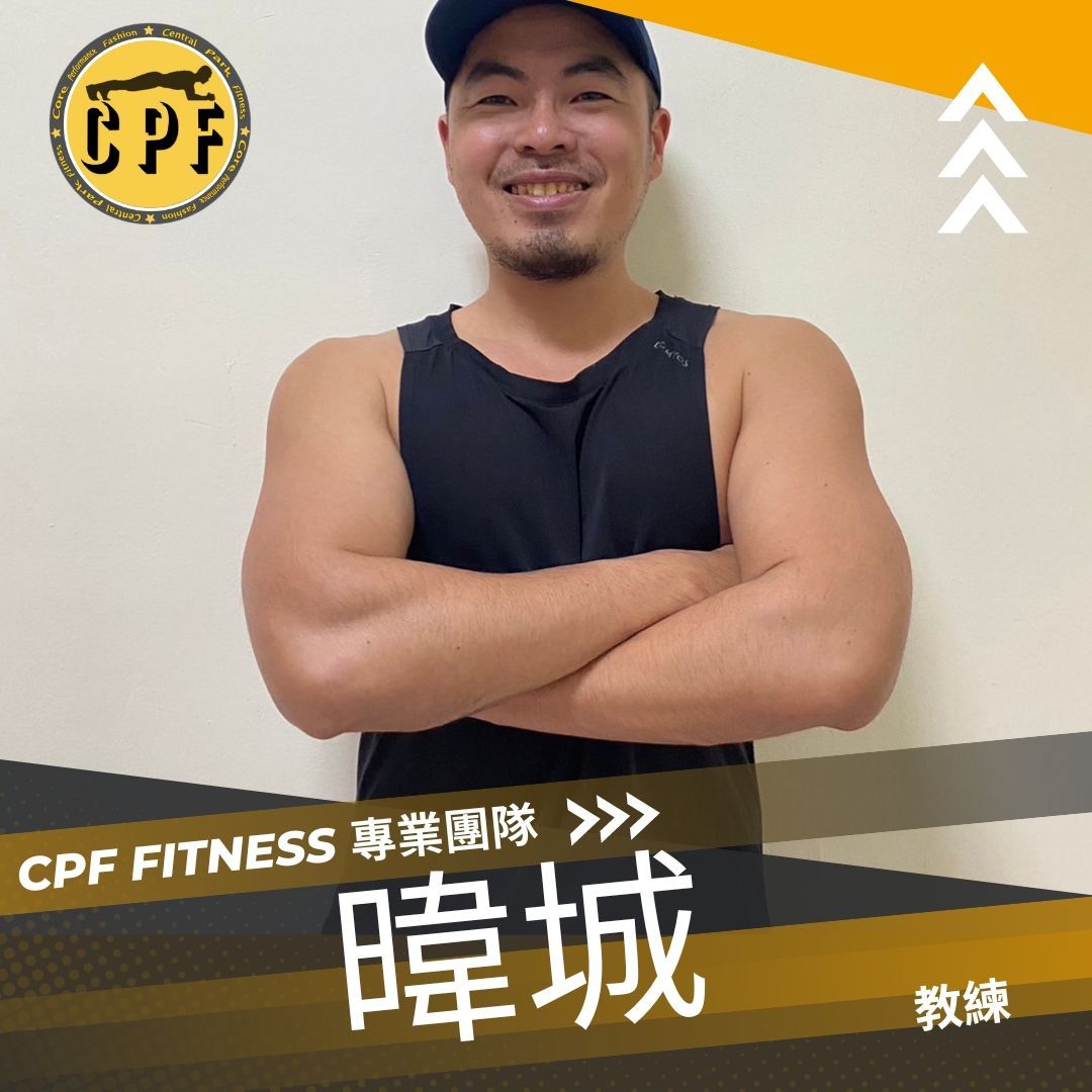 A man with his arms crossed is wearing a black tank top