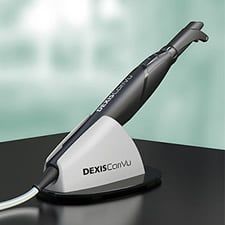 A dental scanner is sitting on top of a table.