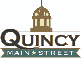 Quincy Main Street logo with gold dome and teal banner on white background