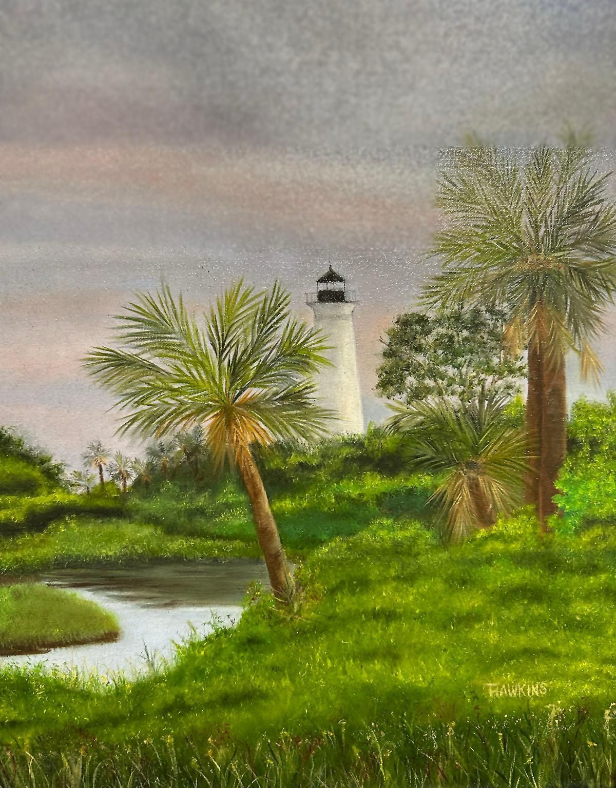 Lighthouse behind palm trees and green marshland under a cloudy sky, with a winding waterway