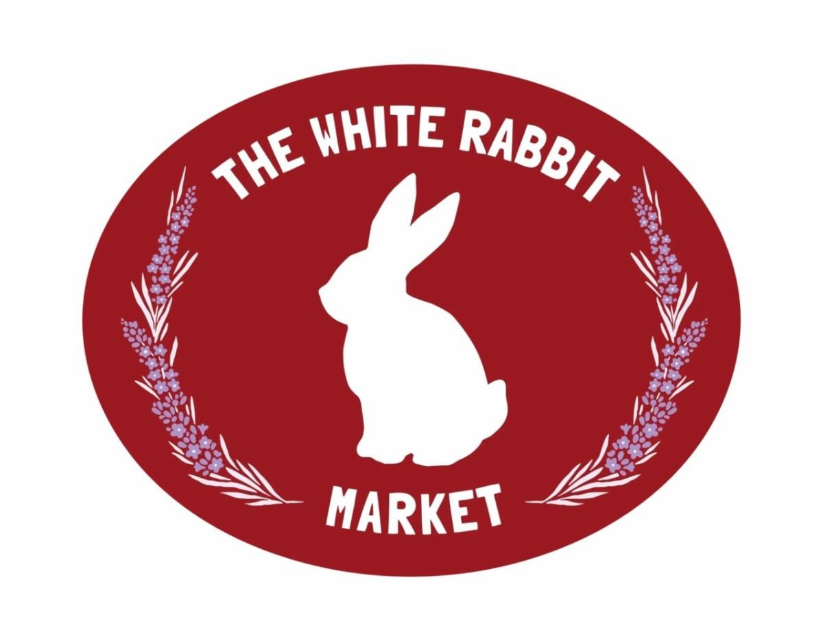 White rabbit logo in a red oval with white text reading “The White Rabbit Market”