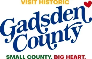 Visit Historic Gadsden County logo in blue, green and red with a small heart and slogan “Small County. Big Heart.”