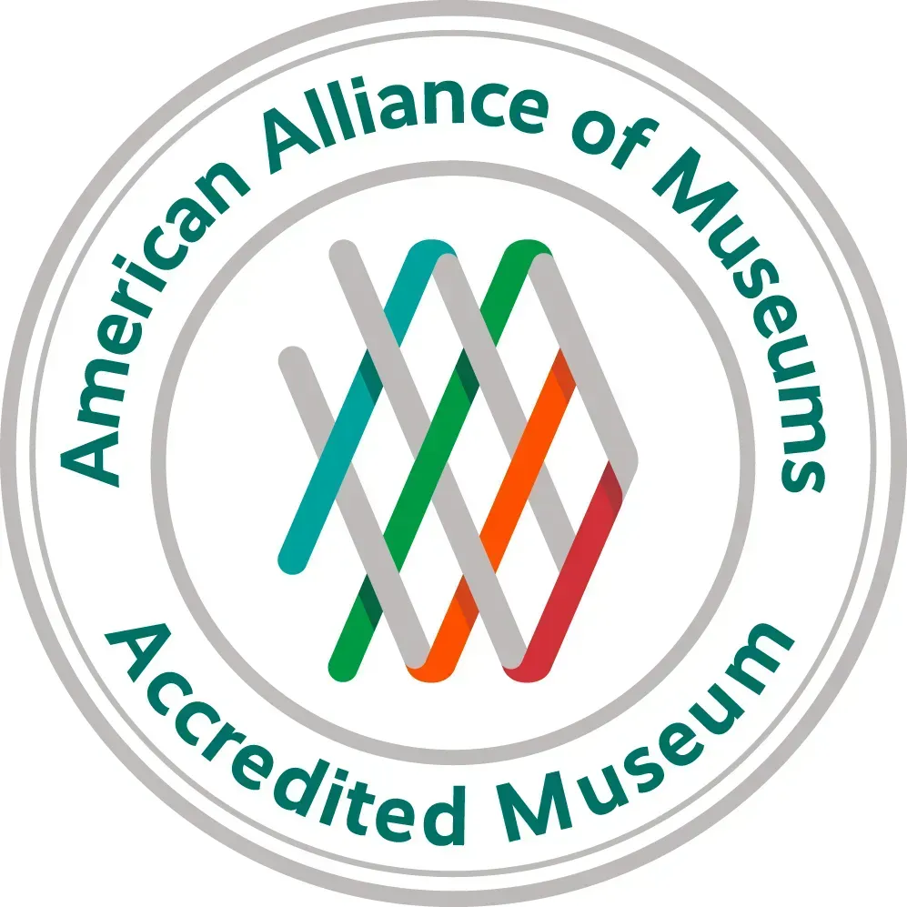 American Alliance of Museums Accredited Museum logo with teal, gray, green, and orange intertwined lines