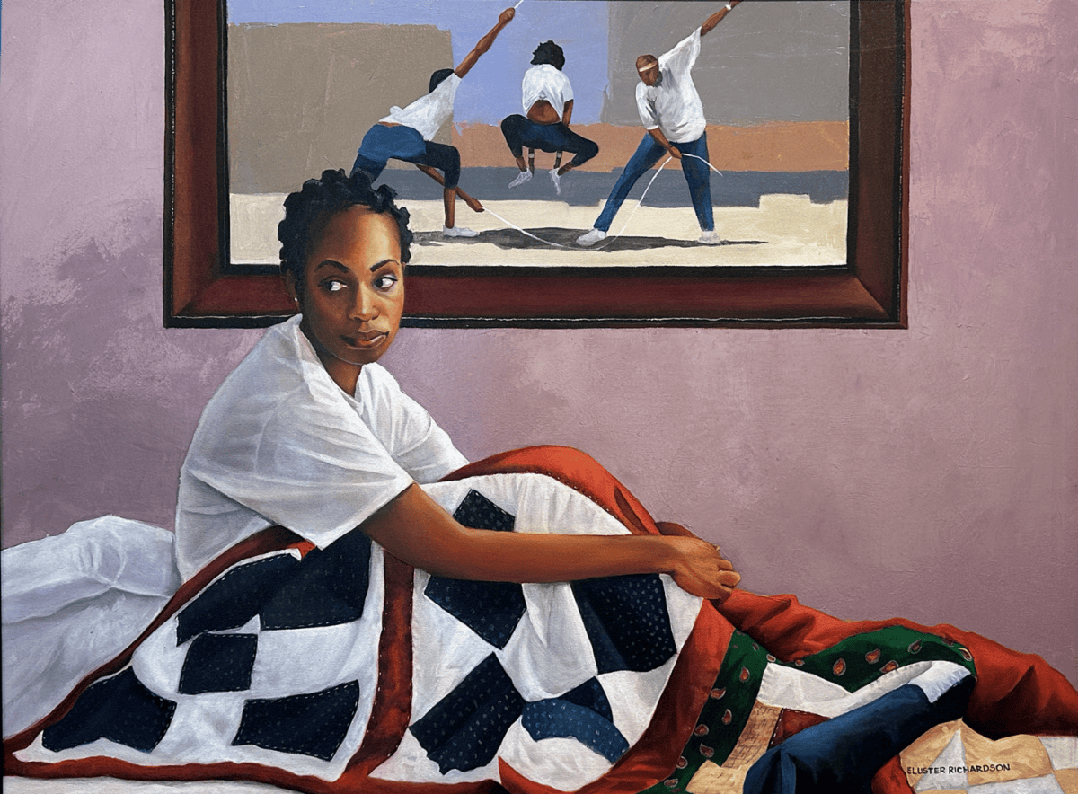 Woman seated on a bed with a quilt, looking toward a framed painting on a mauve wall