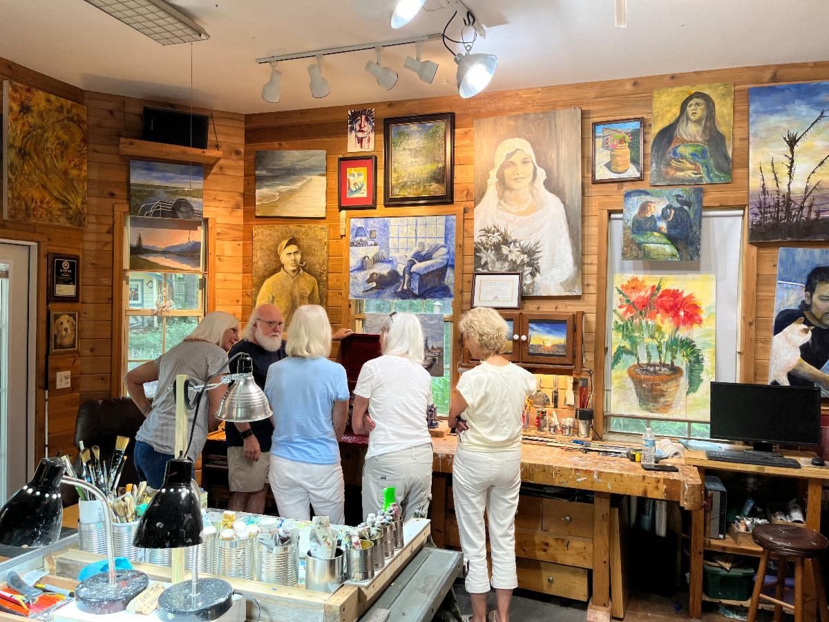 Art gallery interior with visitors browsing colorful paintings and sculptures