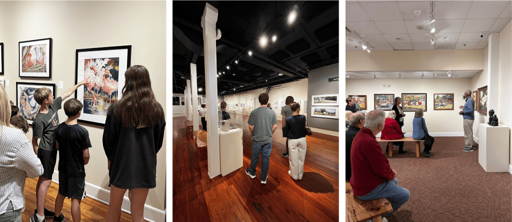Art gallery visitors viewing framed paintings in a bright exhibition space
