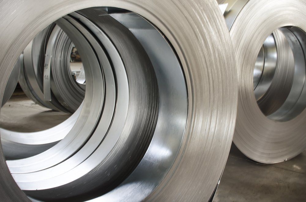 Several Rolls of Metal Are Stacked on Top of Each Other — North Coast Steel in Macksville, NSW